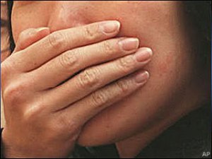 070226hand_over_mouth