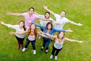 12393950-group-of-people-with-open-arms-outdoors-looking-up